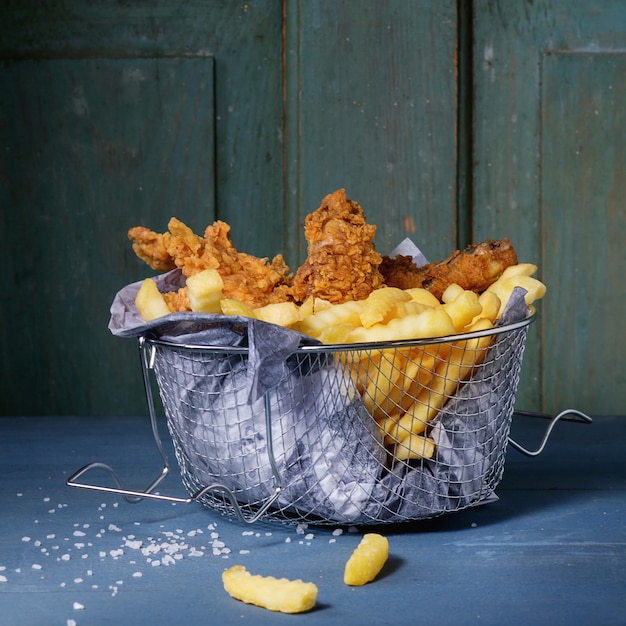 Chicken fries with fried potatoes