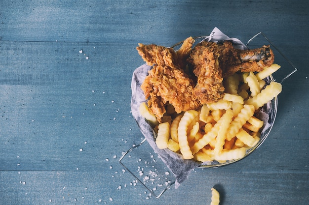 Chicken fries with fried potatoes