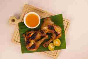 Photo chicken inasal is a filipino style bbq chicken from the western visayas region of the philippines