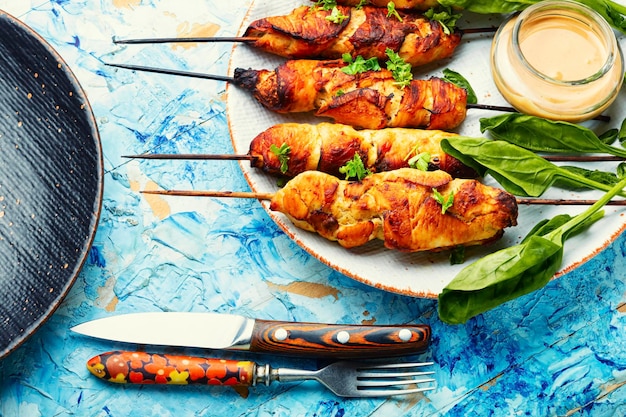 Chicken kebab skewers on a plate