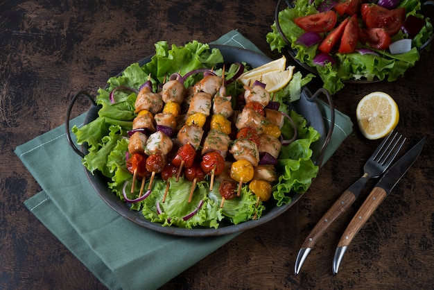 Chicken kebabs with vegetables on skewers