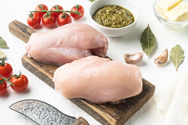 Chicken kiev ingredients with filo set, on white stone  background