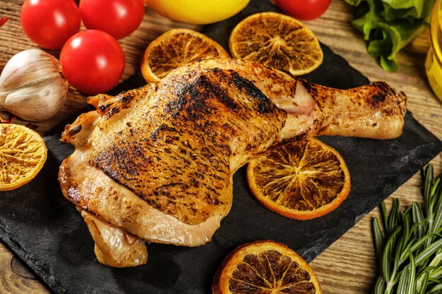 Chicken leg roasted with oranges