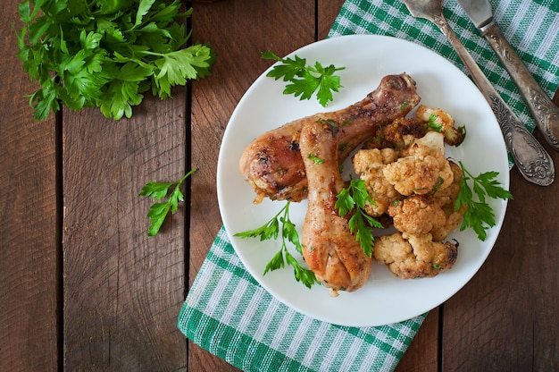 Chicken leg with baked cauliflower and parsley