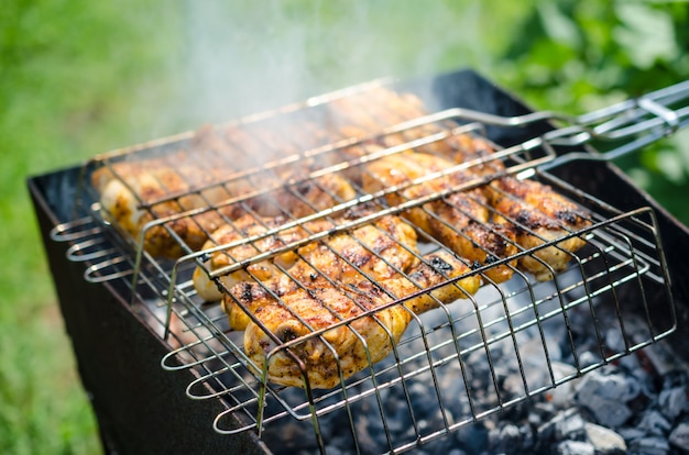 Chicken legs on the grill outside