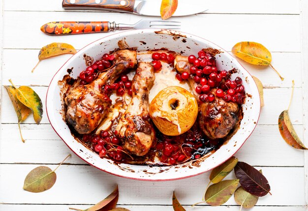 Chicken legs roasted with apples and rowan