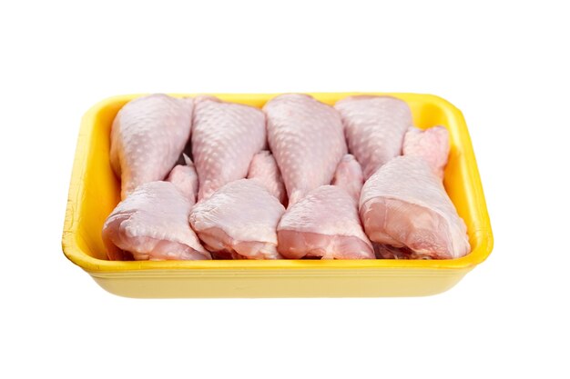 Chicken legs in yellow tray