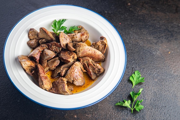 Chicken liver fried stewed offal meal snack on the table copy space food background rustic