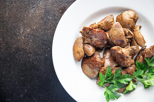 Chicken liver fried stewed offal meal snack on the table copy space food background rustic