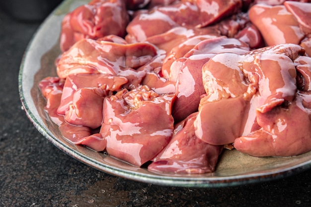 Chicken liver raw piece portion ready to eat meal snack on the table copy space food background