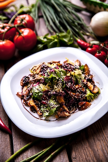 Chicken liver salad with onion, salad and  tomatoes