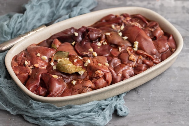 Chicken liver with bay leaf and marinate on dish