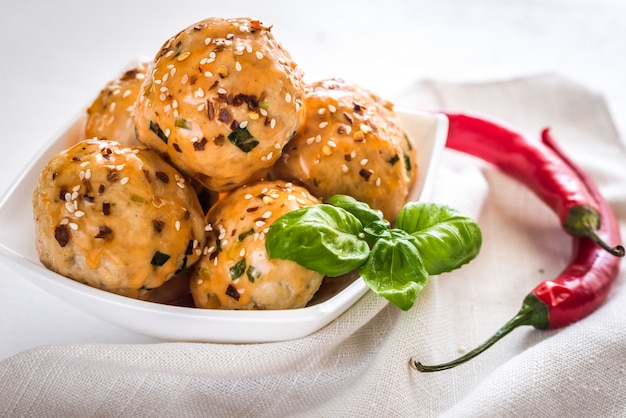 Chicken meatballs under sweet chili pepper sauce