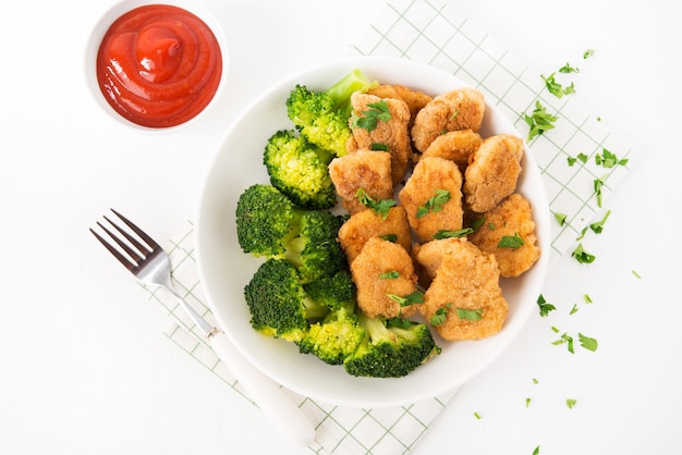 Chicken nuggets with vegetables and broccoli