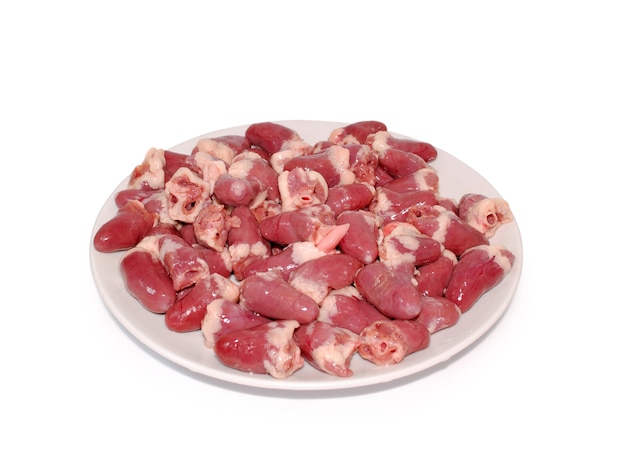 Chicken offal. fresh raw chicken hearts on a dish against white background