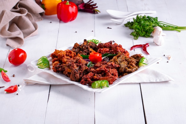 Chicken pakoda or pakorathree different flavors of pakora arranged in a white square plate