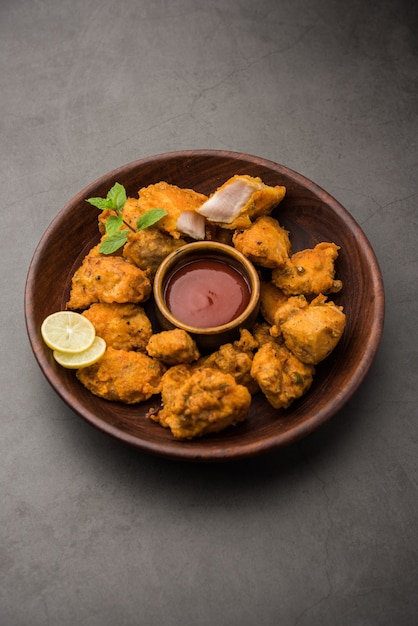 Chicken Pakora or pakoda or fritters is a popular Indian snack in which boneless chicken pieces are marinated and then coated with a mixture of besan, rice flour, cornflour, and egg