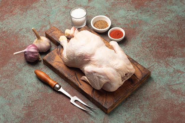 Chicken raw chicken chicken carcass on a textured background