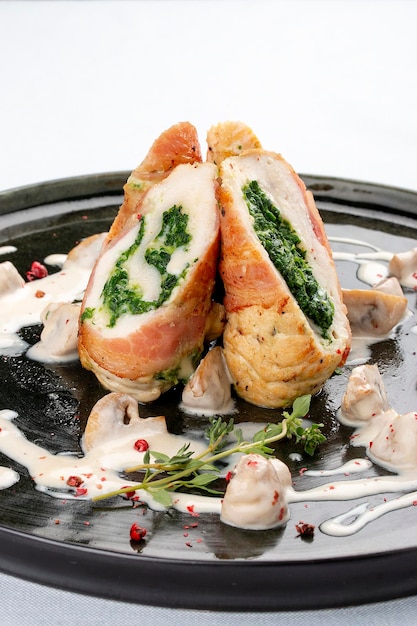 Chicken roll stuffed with spinach and mushrooms