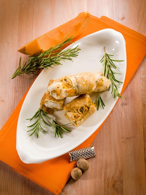 Chicken rolled up with pumpkin and rosemary