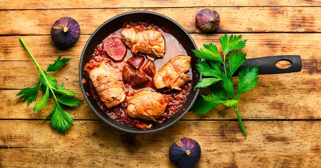 Chicken rolls with fig on rustic wooden table