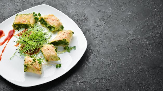 Chicken rolls with spinach and cheese Top view Free space for your text