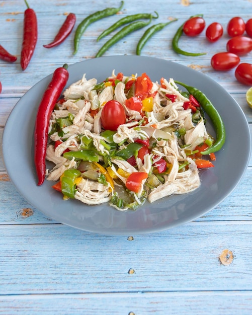 Chicken salad on blue wooden background healthy food