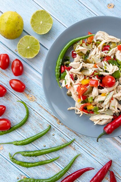 Chicken salad on blue wooden background healthy food