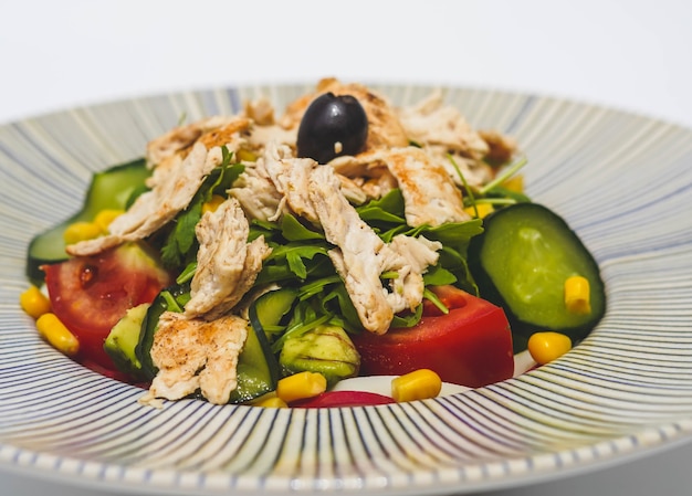 Chicken salad with lettuce tomato and cucumber