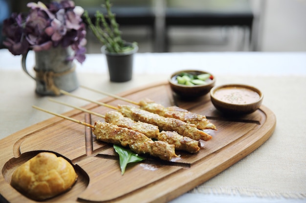 Chicken Satay on wood