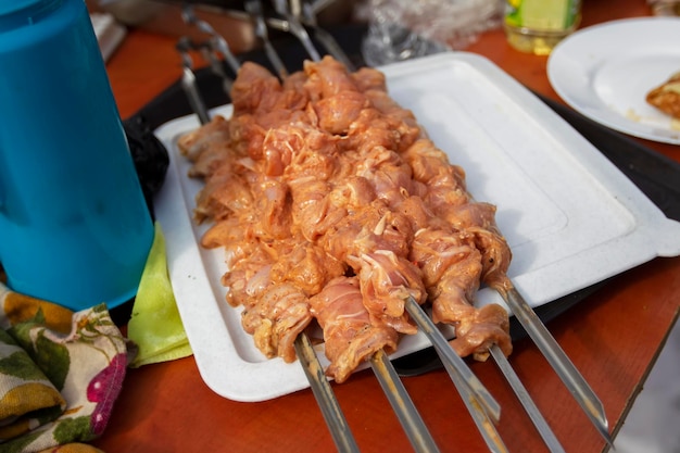 Chicken skewers marinated on skewers and ready to cook Semifinished product for barbecue