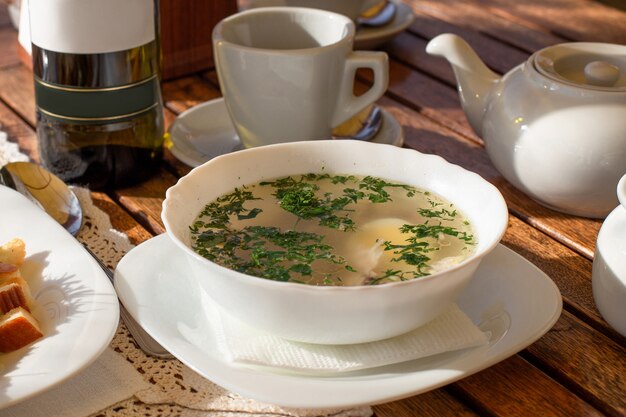 Chicken soup with letuce and eggs