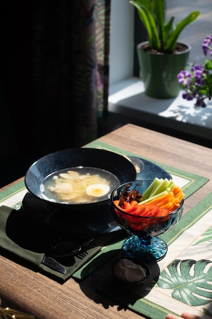 Photo chicken soup with vermicelli and egg