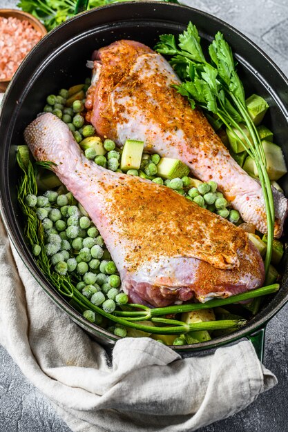 Chicken stew. Recipe for drumsticks with parsley, peas, celery and potatoes. 