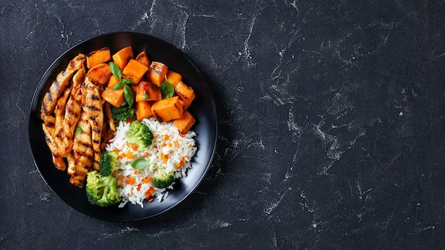 chicken strips served with veggies and rice