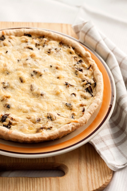 Chicken tart with mushrooms and cheese on a plate