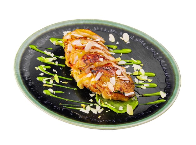 Chicken tenderloin with roasted almonds on plate