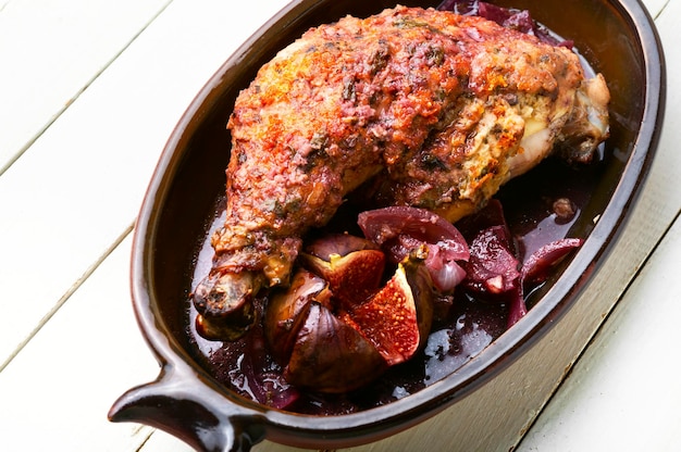 Chicken thigh fried in fig fruit. Meat poultry with figs sauce.