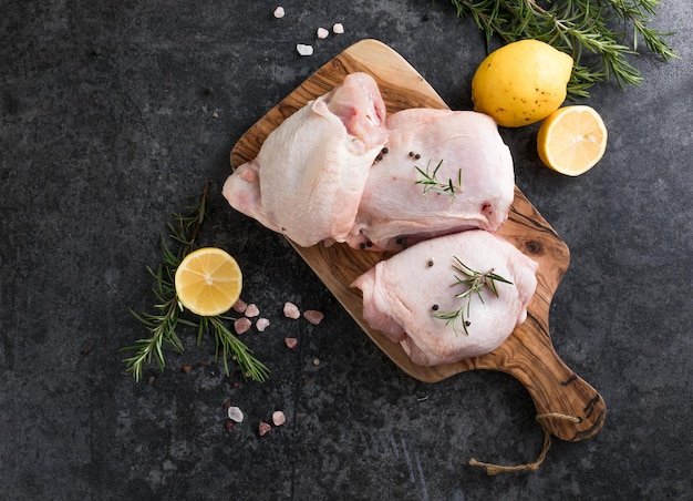 Chicken thighs with lemon fresh rosemary Copy space