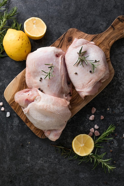 Chicken thighs with lemon fresh rosemary Copy space