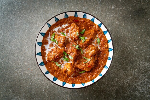 Foto pollo tikka masala curry piccante a base di carne cibo stile alimentare indiano