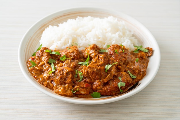 chicken tikka masala with rice on plate - Indian food style