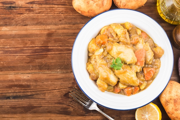 Chicken wings in curry in a bowl