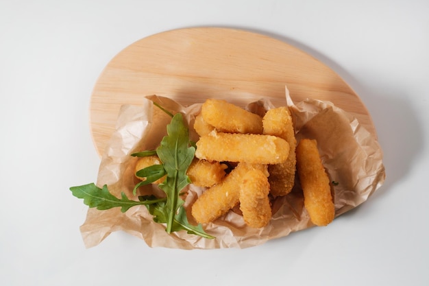 Chicken wings with salad on wooden board