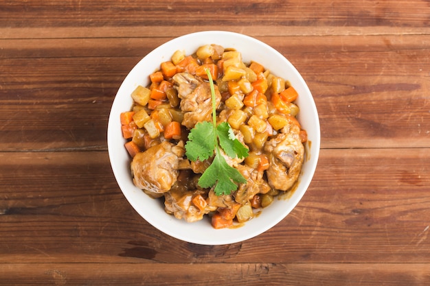 Chicken with potato and carrot in curry,