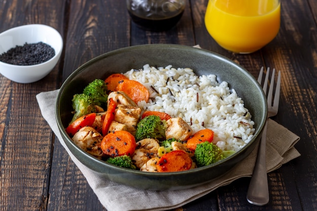 Chicken with rice, broccoli, carrots and soy sauce. Healthy eating. Diet. Recipe.