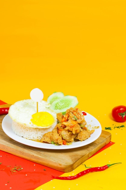 Chicken with salted egg and beef eye egg on a colorful background