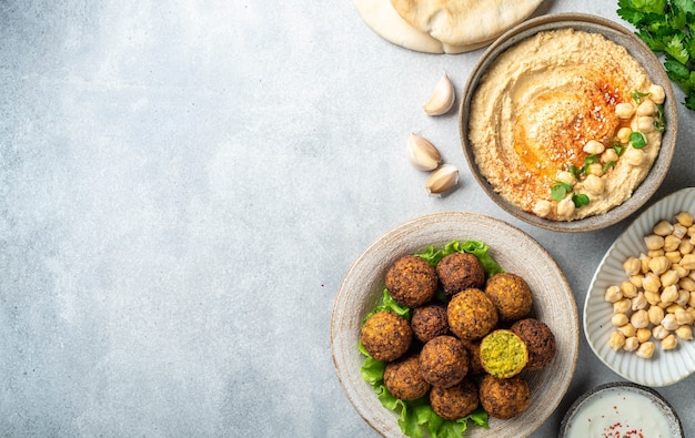 Chickpea dishes falafel and hummus on a concrete surface top view copy space