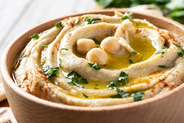 Chickpea hummus on a rustic wooden table