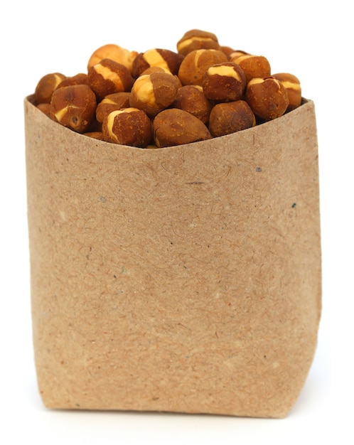 Chickpea in a paper pack over white background